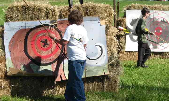 Participants remove darts from targets.